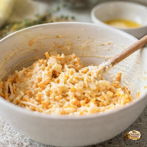 folding everything together until the potatoes are evenly coated with the creamy cheese mixture.